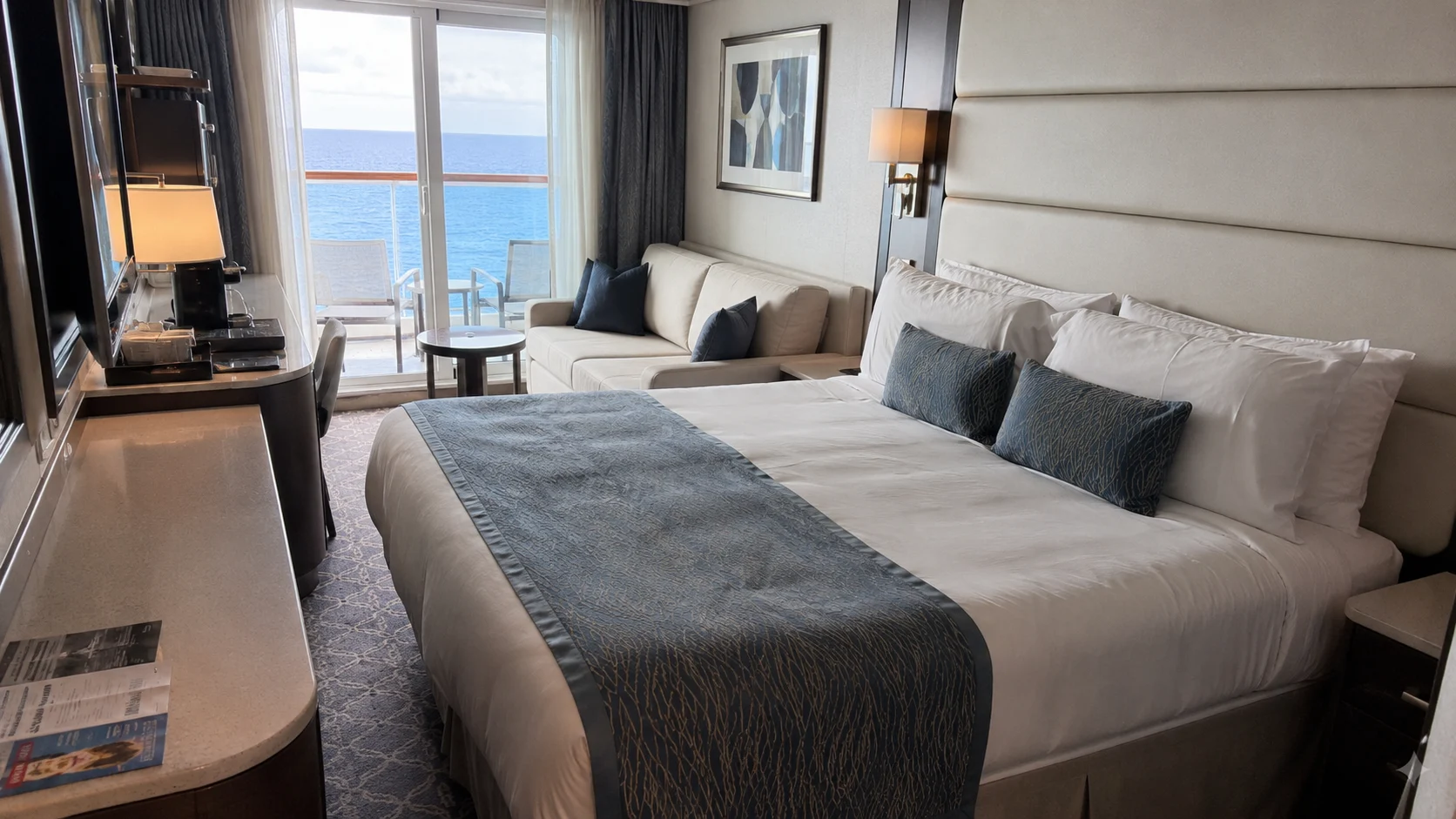Star Princess balcony cabin with a double bed and sofa