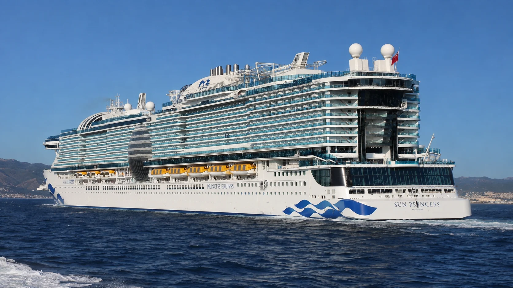 Sun Princess sailing across calm blue water