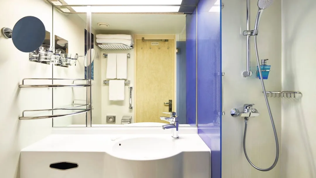 Representative Marella Voyager cabin bathroom with a shower and sink