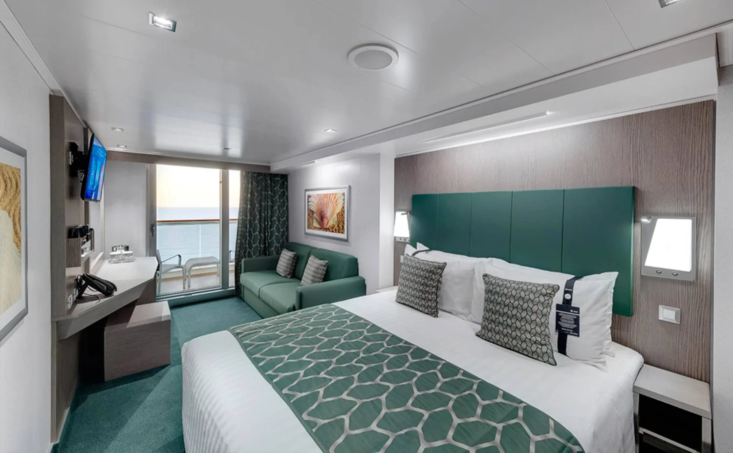 Representative MSC Seaview balcony stateroom with a bed and sofa