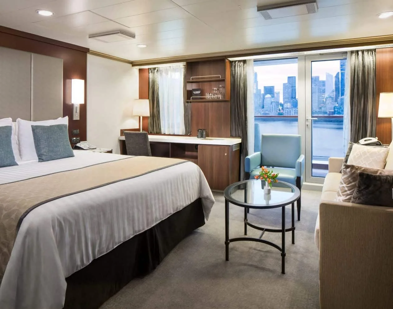 Representative Nieuw Amsterdam Signature Suite bedroom and sitting area