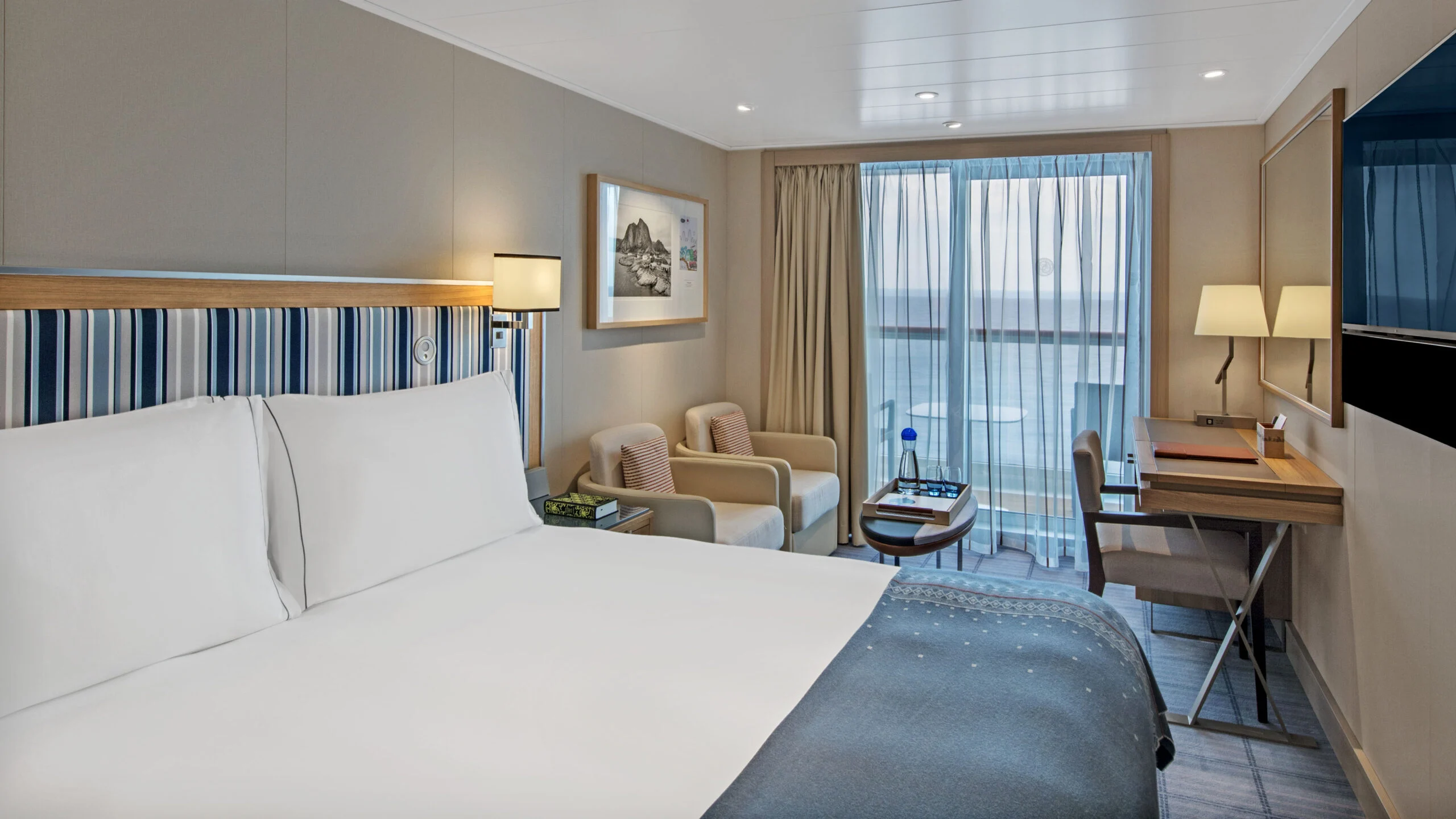 Viking ocean-fleet Deluxe Veranda representative bedroom, shown on the Vela accommodation page